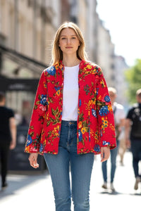 Model wearing Les Sûtras Cotton - Quilted Jacket Reversible- Pink with Blue Flowers paired with white tee and blue jeans. 