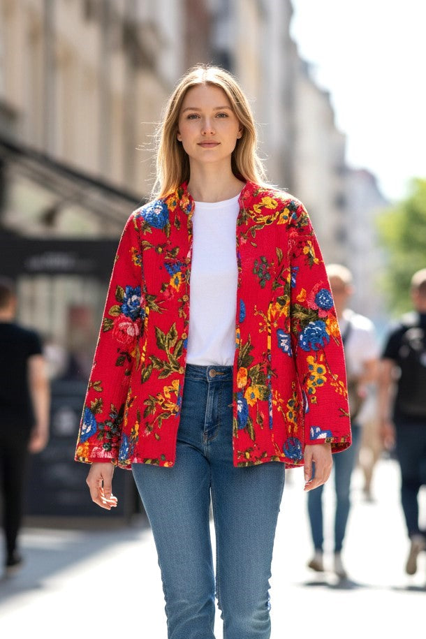 Model wearing Les Sûtras Cotton - Quilted Jacket Reversible- Pink with Blue Flowers paired with white tee and blue jeans. 