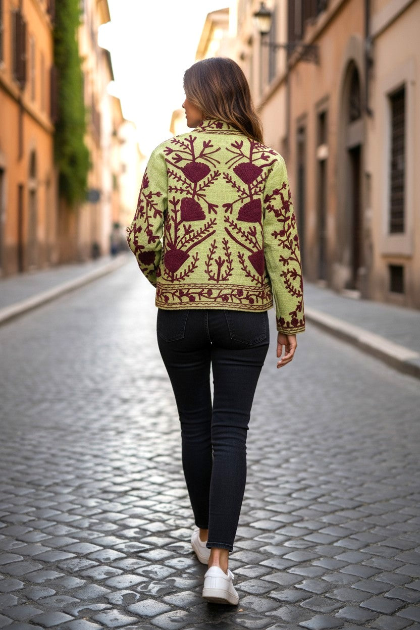 Model wearing Les Sûtras' Cotton Suzani Embroidered Jacket - Mint Green and Red