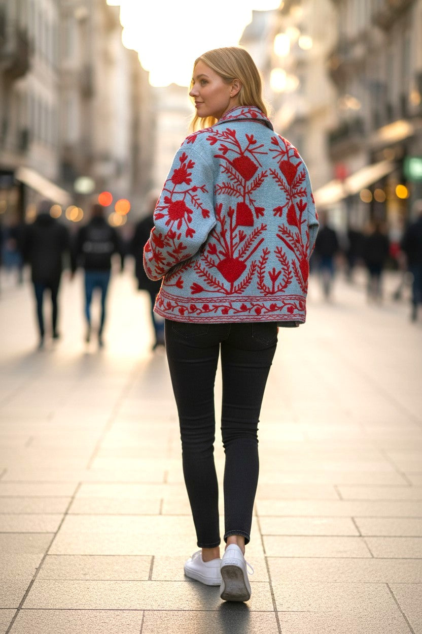 Model wearing Les Sûtras Cotton Suzani Embroidered Jacket - Turquoise and Red
