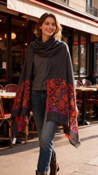 Model wearing Les Sûtras Fine Wool Scarf with Heritage Border – Black.