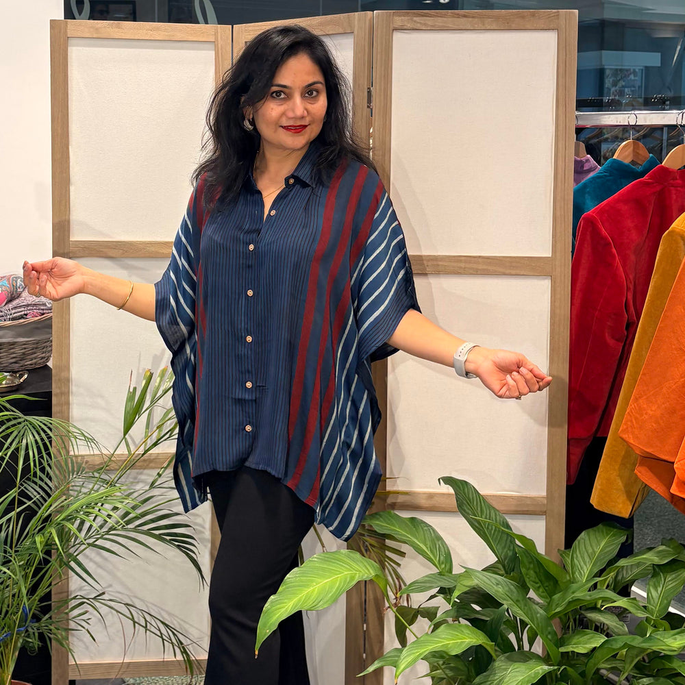 Zenia wearing Les Sûtras Modal Silk Kaftan - Block Print Top - Blue with black trousers