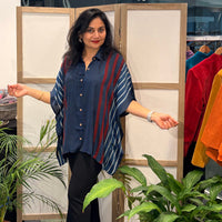 Zenia wearing Les Sûtras Modal Silk Kaftan - Block Print Top - Blue with black trousers