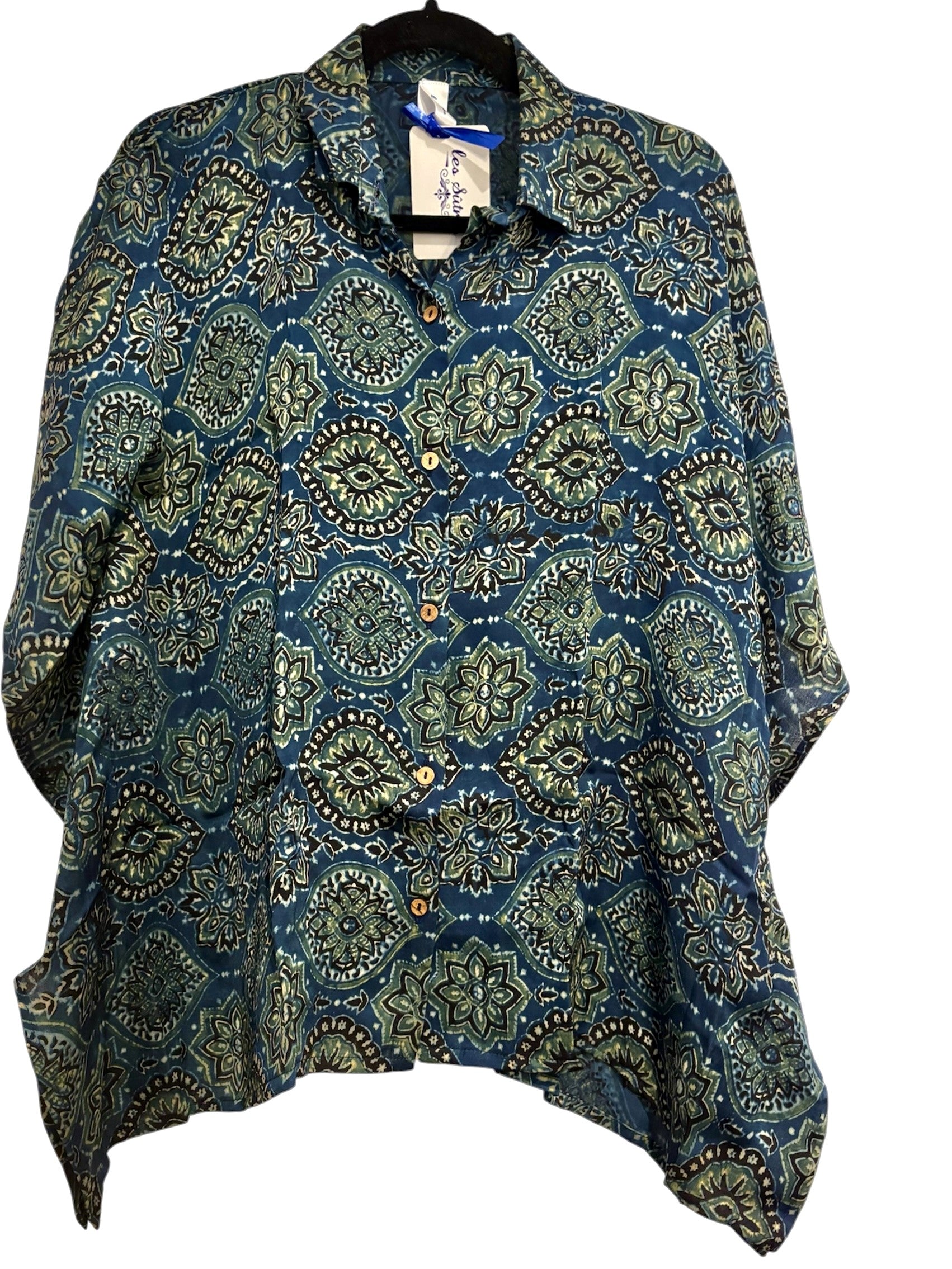 Block Print patterned poncho on a white background