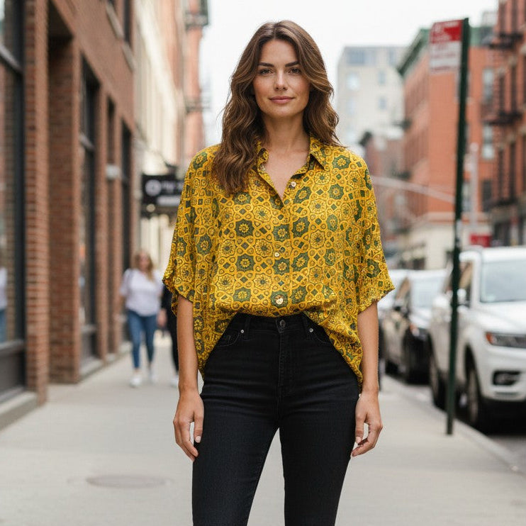 Model wearing Modal Silk Kaftan - Block Print Top - Yellow paired with denim trousers.