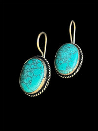Turquoise drop earring.