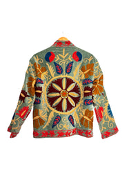 Les Sûtras colourful Velvet Suzani - Embroidered Green Jacket on a white background