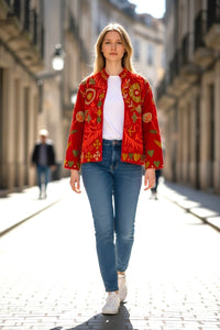 Model  wearing a Les Sûtras Velvet Suzani - Orangish Red - Embroidered Jacket on a city street